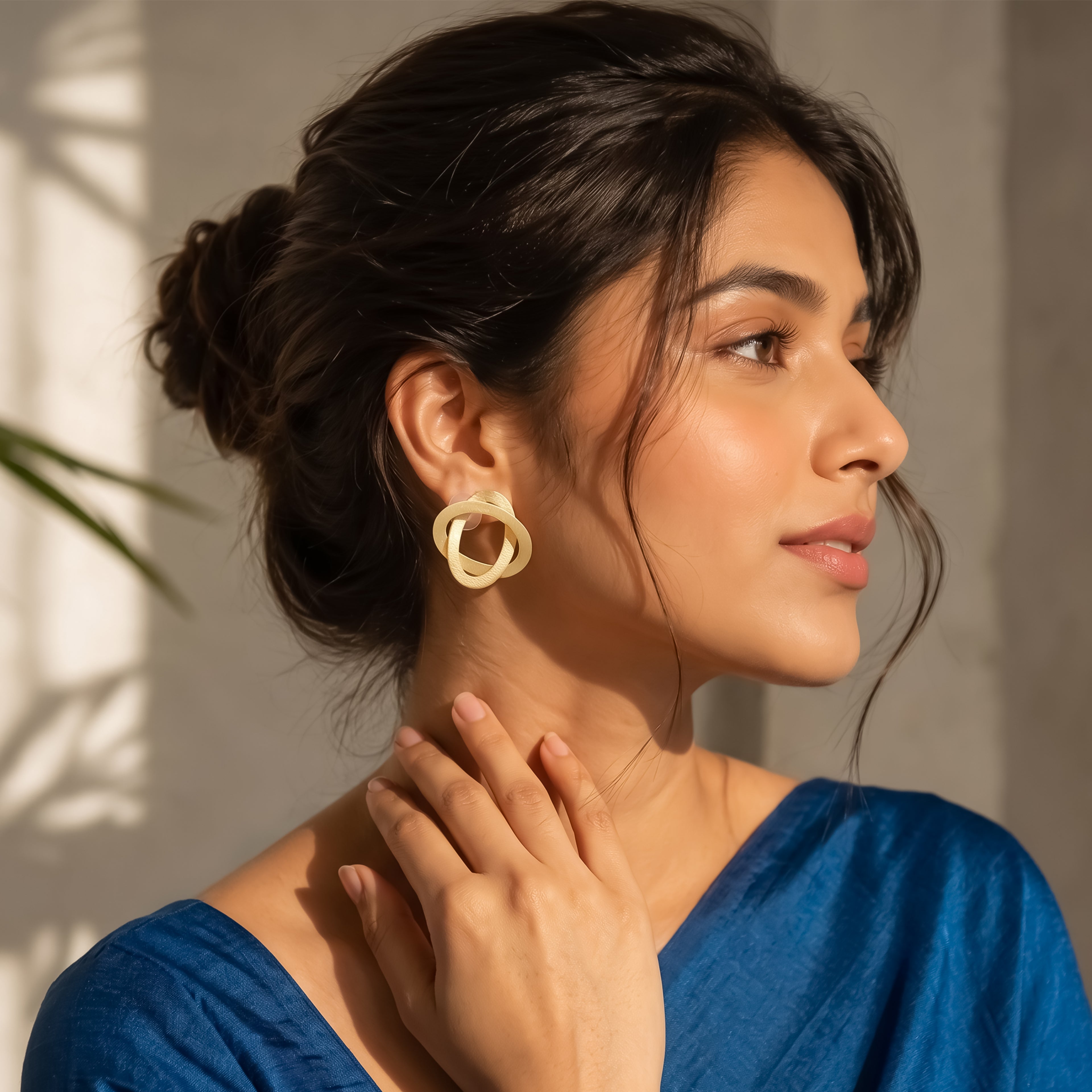 Interwoven Gold Statement Stud Earrings