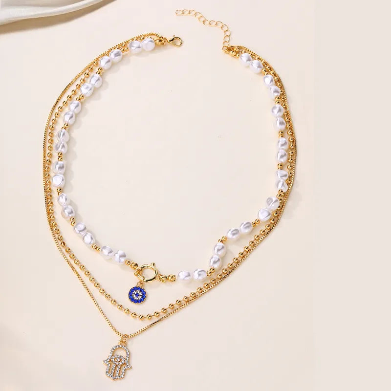 Gold Layered Hamsa Hand & Evil Eye Pearl Necklace Set