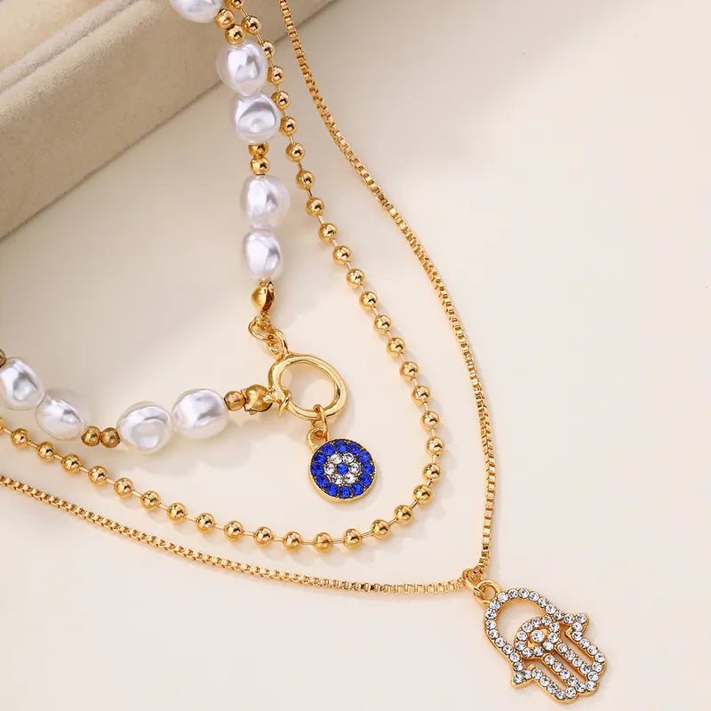 Gold Layered Hamsa Hand & Evil Eye Pearl Necklace Set